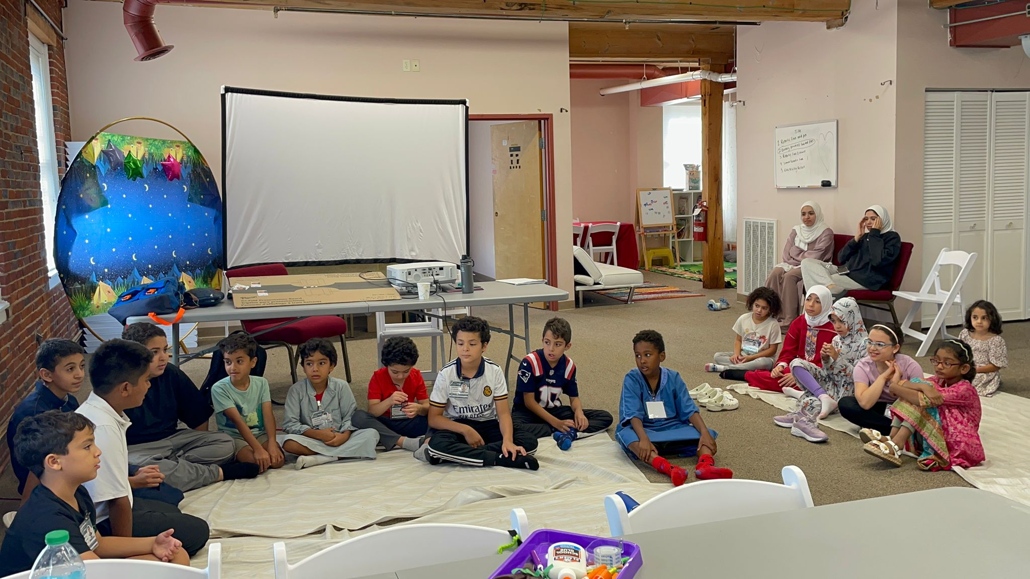 Children engaged in STEAM learning activities at Nashia