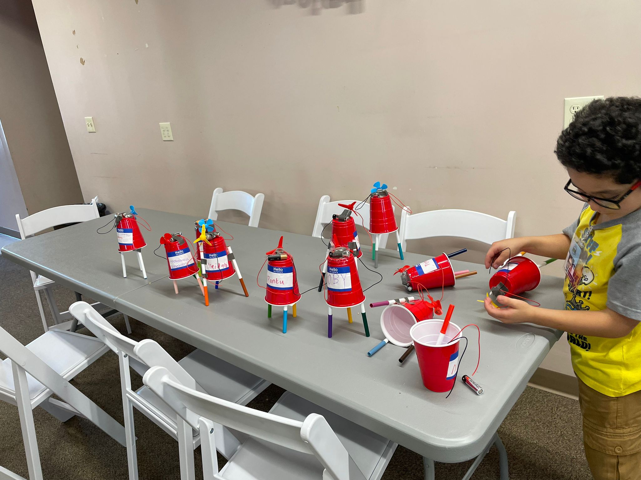 Kids building with colorful cups